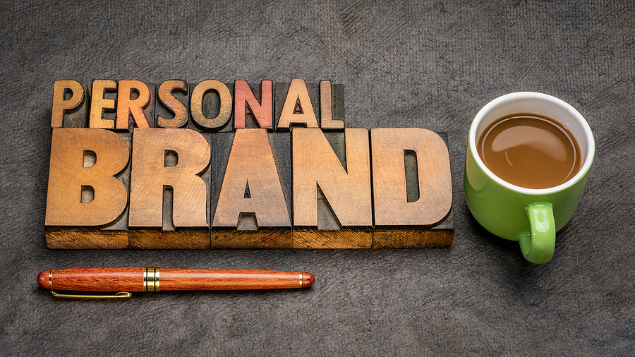 Personal brand word abstract - text in vintage letterpress wood type printing blocks with a up of coffee, business and personal development concept